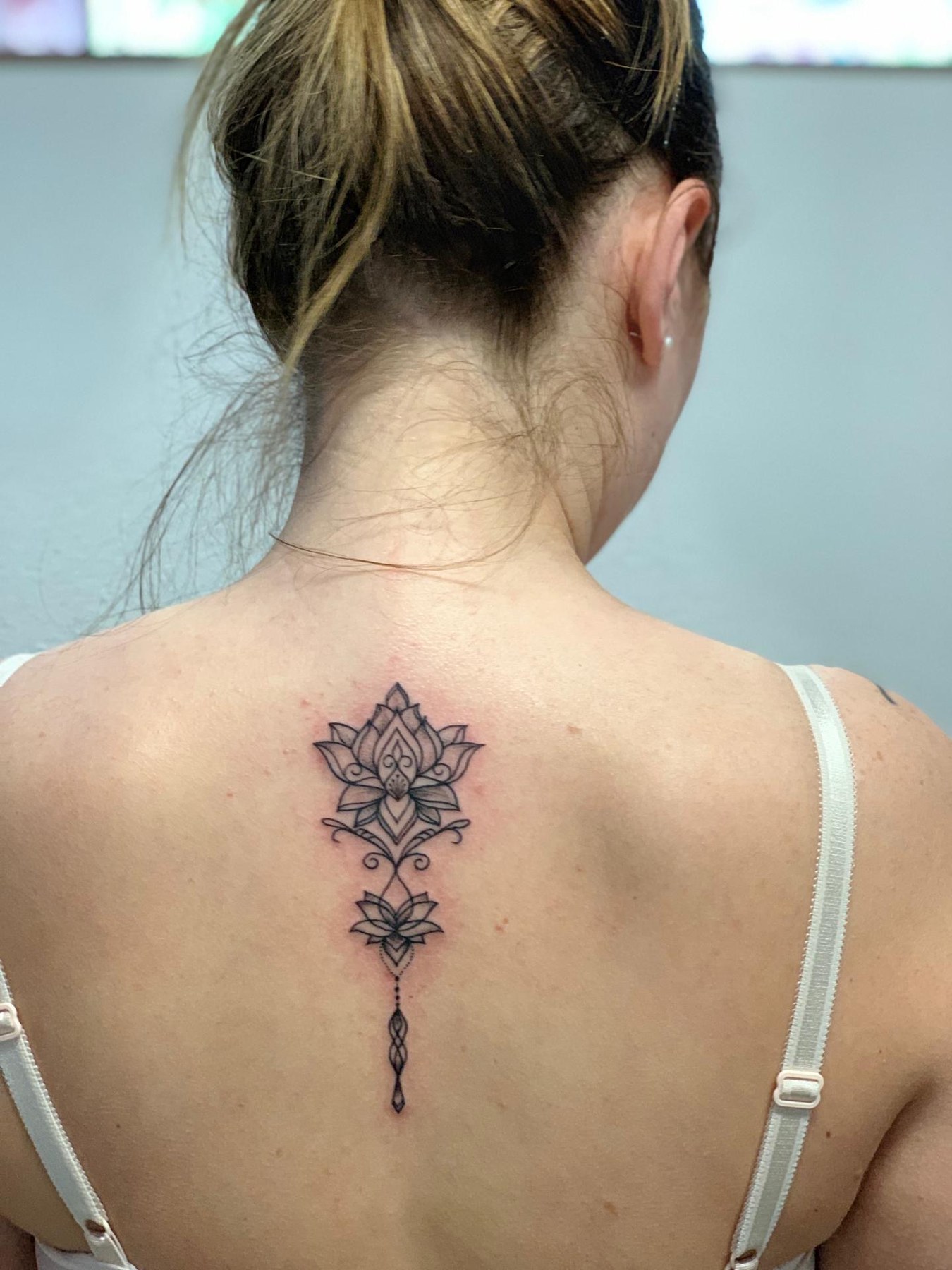 Lotus back tattoo angled view