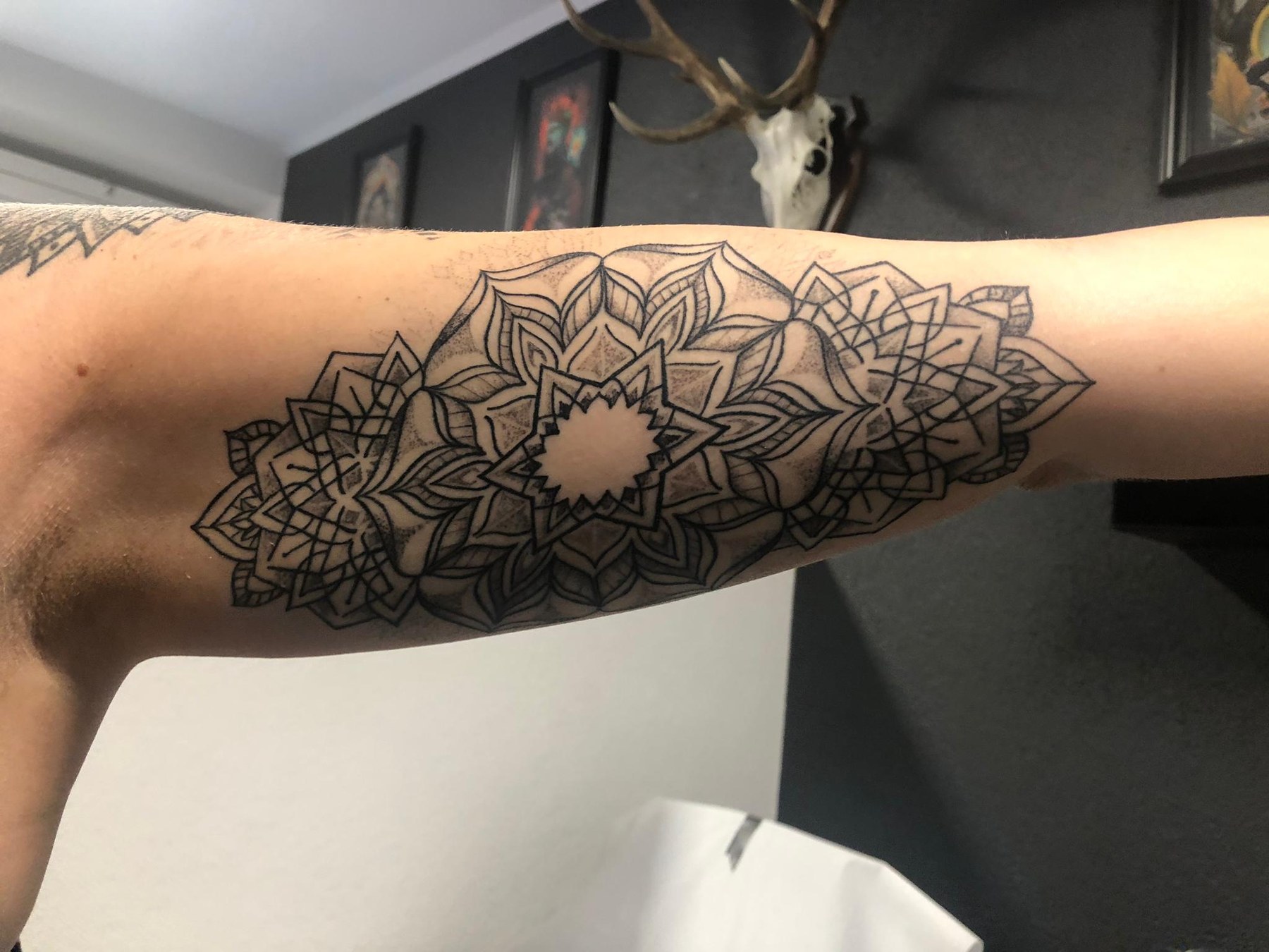 Mandala arm tattoo