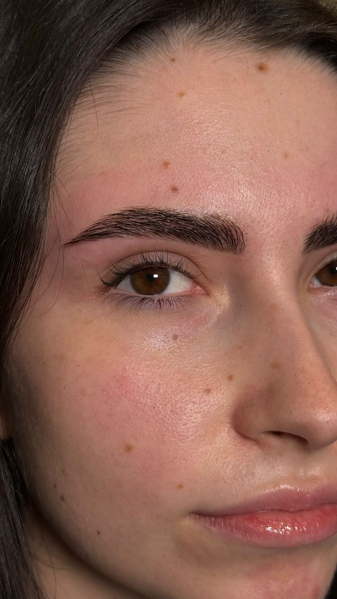 Detailed close-up of precision brow work
