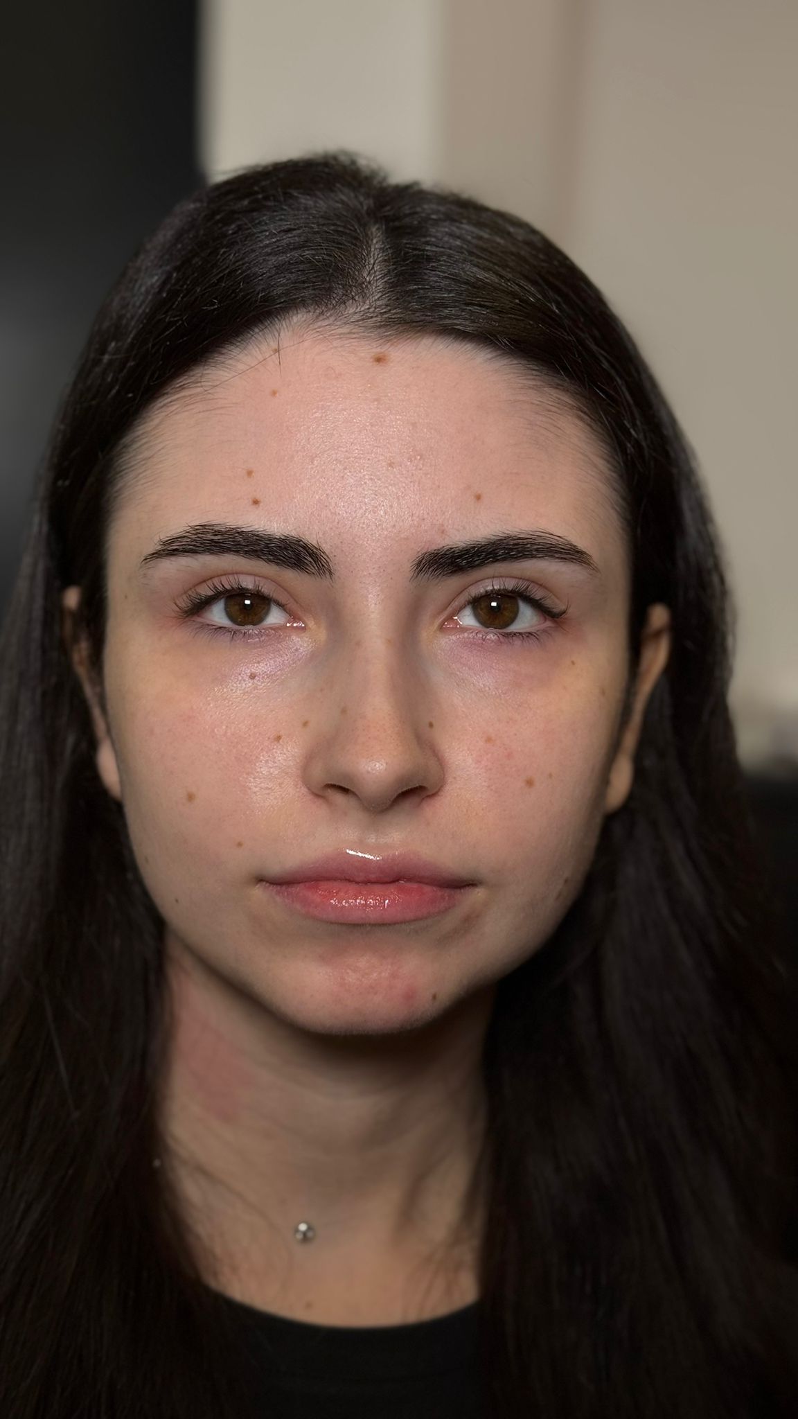 Front portrait showing symmetrical brow styling