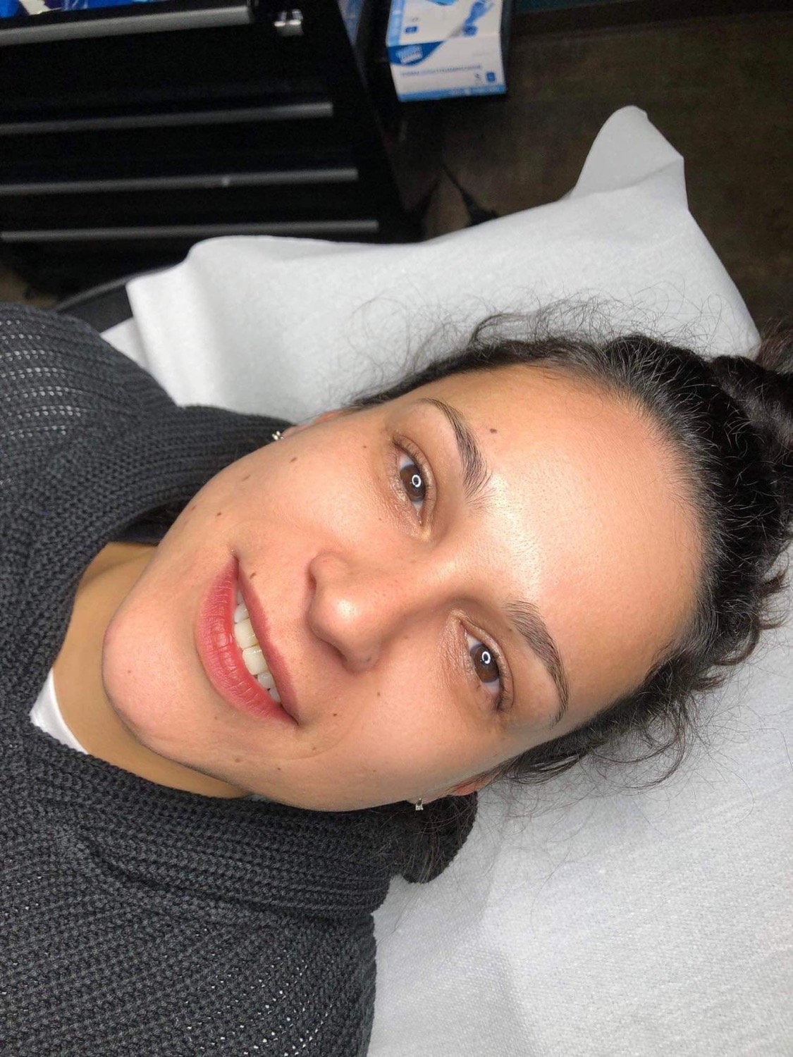 Smiling client after brow styling